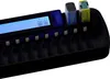 A close-up of a black battery charger with a blue display screen and two batteries inserted. Produktbild-Vorschau