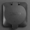 A close-up, top-down view of a black charging station cover with the "PHOENIX CONTACT" logo embossed on it. Náhled obrázku produktu