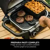 A person is using a grill to cook burgers and curly fries. Anteprima dell’immagine prodotto