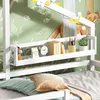 A close-up view of a white wooden children's bed with a shelf displaying various items, set against a green woodland-themed wallpaper. Produktbild-Vorschau