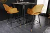 Two bar stools in a modern dining area, next to a high table. Produktbild-Vorschau
