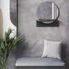 A modern entryway with a mirror, shelf, bench, and plant. Produktbild-Vorschau