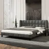 A modern bedroom setting with a gray upholstered bed as the main focus. Anteprima dell’immagine prodotto