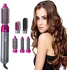 Graues und magentafarbenes 5-in-1-Haarstylinggerät mit mehreren Aufsätzen neben einer Frau mit langen, welligen braunen Haaren Podgląd zdjęcia produktu