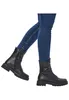 A person wearing blue jeans and black leather boots, shown from the knees down, against a white background. Produktbild-Vorschau