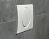 A close-up shot of a white toilet flush button mounted on a gray tiled wall. Produktbild-Vorschau