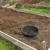 A garden sieve is placed on prepared soil in a raised garden bed. Anteprima dell’immagine prodotto