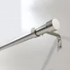 A close-up view of a silver curtain rod mounted on a white wall. Produktbild-Vorschau