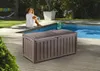 A woman sits by a pool next to a storage box. Podgląd zdjęcia produktu