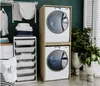 A laundry room with a stacked washer and dryer, storage shelves, and plants. Anteprima dell’immagine prodotto