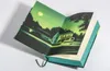 An open book with a colorful illustration of a house at night. Produktbild-Vorschau