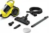 A yellow and black Kärcher vacuum cleaner with various attachments, laid out on a white background. Voir les images du produit