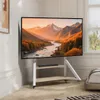 A TV stand with a television displaying a landscape image, placed in a room with a window and a bed. Podgląd zdjęcia produktu