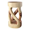 A wooden stool with a twisted base. Anteprima dell’immagine prodotto