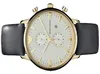 A close-up studio shot of a gold Emporio Armani chronograph watch with a white face and a black leather strap. Produktbild-Vorschau
