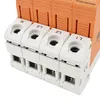 A close-up view of the terminals of a four-pole surge protector. Anteprima dell’immagine prodotto