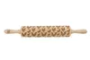 A wooden rolling pin with a chicken pattern engraved on it, presented against a white background. Voir les images du produit