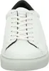 A close-up, front-facing view of a white leather sneaker. Voir les images du produit