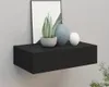 A black floating shelf mounted on a light gray wall, decorated with two vases and a potted plant. Produktbild-Vorschau