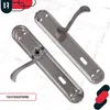 Two silver door handles with escutcheons are displayed on a blueprint background. Produktbild-Vorschau