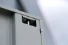 Close-up of a gray metal corner with a latch mechanism. Produktbild-Vorschau