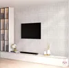 A modern living room with a wall-mounted TV and a sleek entertainment unit. Anteprima dell’immagine prodotto