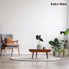 A living room scene with a chair, coffee table, and plants. Náhled obrázku produktu