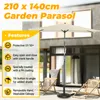 A garden parasol is set up on a patio with two lounge chairs. Produktbild-Vorschau