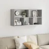 A gray wall-mounted shelf unit filled with decorative items, positioned above a sofa. Náhled obrázku produktu