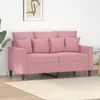 A pink sofa with pillows in a room. Produktbild-Vorschau