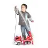 A young boy is playing with a toy fire engine. Anteprima dell’immagine prodotto