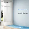 A modern, barrier-free shower enclosure with a glass wall and a blue floor featuring accessibility symbols. Produktbild-Vorschau