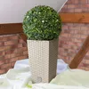 A spherical artificial plant in a square planter. Náhľad obrázku produktu