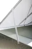 A close-up view of the interior structure of a greenhouse roof, showing metal framing and translucent panels. Voir les images du produit