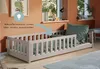 A child's bedroom with a bed and toys. Voir les images du produit