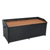 A black rattan storage bench with a wooden lid, shown against a white background. Produktbild-Vorschau