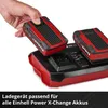 A hand is placing a battery into a charger, with another battery already in the charger. Voir les images du produit