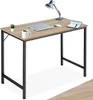 A desk with a laptop, mug, plant, lamp, and notebook. Produktbild-Vorschau