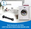 A washing machine in a laundry room with a person relaxing on a couch in the background. Produktbild-Vorschau