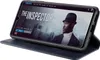 A smartphone in a blue flip case is displayed, showing a movie streaming interface on its screen. Produktbild-Vorschau
