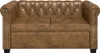 A brown Chesterfield sofa is shown from the front. Produktbild-Vorschau