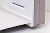 Close-up view of a white PVC window seal profile attached to a white surface, with a gray ribbed profile visible on the right. Podgląd zdjęcia produktu