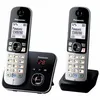 A product shot of two Panasonic cordless phones and their charging base, set against a white background. Voir les images du produit