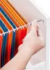 A hand is shown inserting a hanging file folder into a filing cabinet. Produktbild-Vorschau
