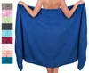 A person is holding a large blue towel behind them, with a collage of other towel colors on the left. Produktbild-Vorschau