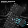 A black phone case with a ring holder is shown attached to a car vent mount. The case has a rugged, armored design and a sliding camera cover. Produktbild-Vorschau