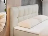 A close-up view of a beige upholstered bed with a tufted headboard and two pillows. Produktbild-Vorschau