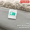 Close-up of the underside of a rug, showing the label and the anti-slip backing. Anteprima dell’immagine prodotto