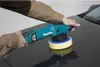 A person is using a teal and black Makita polisher on the dark hood of a car. Podgląd zdjęcia produktu