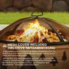 A close-up of a fire pit with a mesh cover and flames, with text describing its features. Produktbild-Vorschau